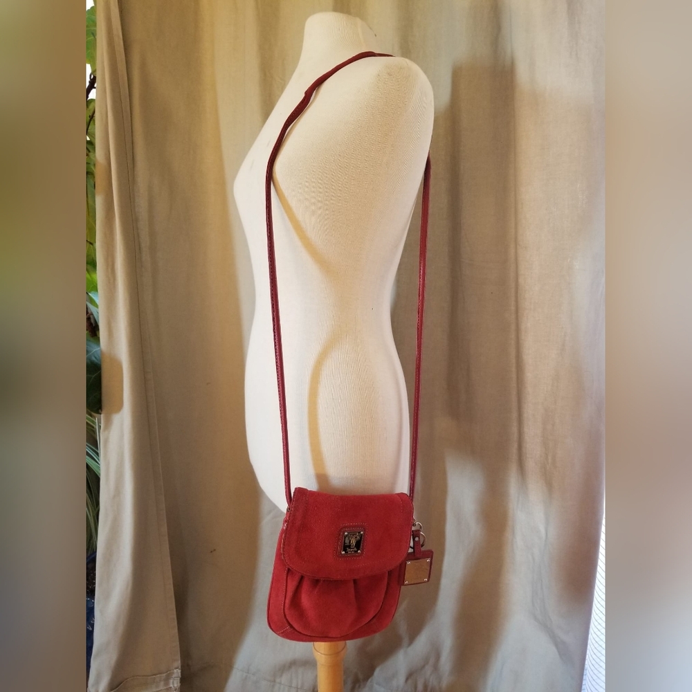 Red shoulder bag with metal details